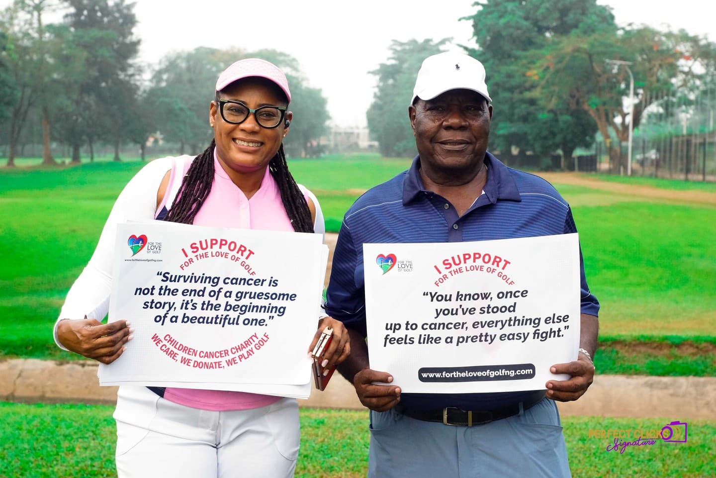 Two golfers holding signs with messages of hope and resilience in the face of cancer